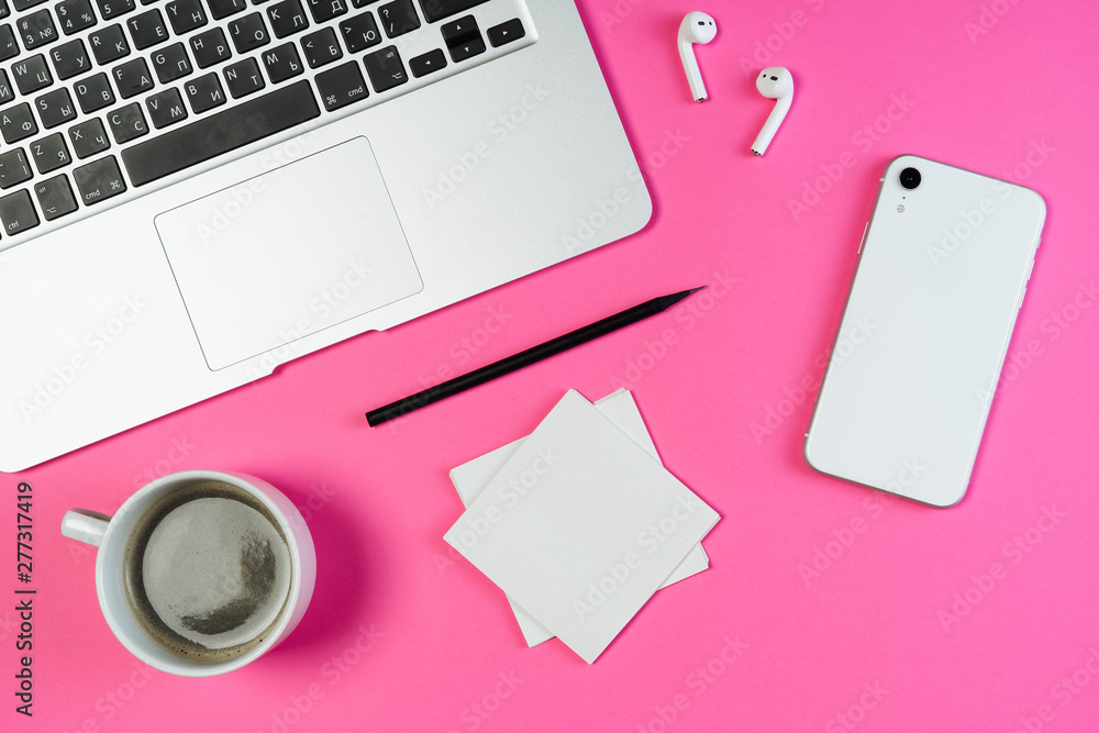 Wall mural laptop phone coffee pink business workplace top flat lay. white smartphone, airpod and pencil on min