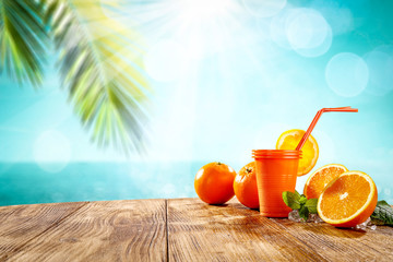 Summer drink sunrise on desk and beach landscape 