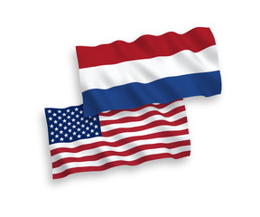 National vector fabric wave flags of Netherlands and USA isolated on white background. 1 to 2 proportion.