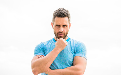 man athlete in blue sport tshirt. sportswear fashion. muscular male with beard. thoughtful man isolated on white. sportsman with athletic body. coach in fitness gym. after workout. Relax after train