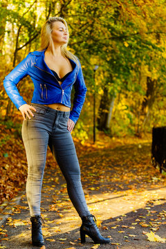 Fashion woman walking in autumn park
