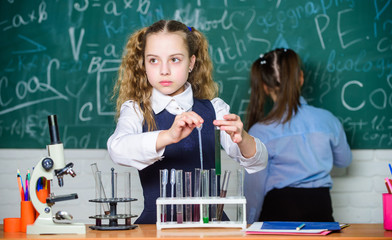 Smart and confident children. Chemistry lesson. students doing biology experiments with microscope in lab. Little kids learning chemistry in school lab. Chemistry equipment. Chemistry education