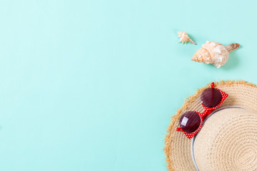 summer holiday beach background with accessories on blue table, top view with copy space. vacation concept