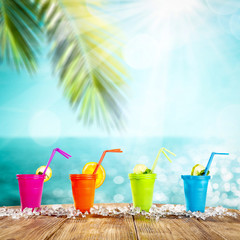 Summer drink on desk and beach landscape 