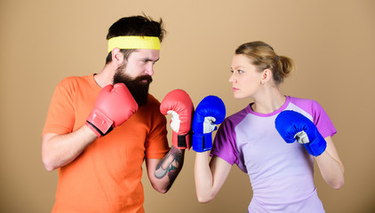 Sport for everyone. Amateur boxing club. Equal possibilities. Strength and power. Man and woman in boxing gloves. Family battle. Boxing sport concept. Couple girl and hipster practicing boxing