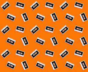 Seamless pattern with vintage white audio tape cassette concept illustration isolated on orange background, 3d rendering