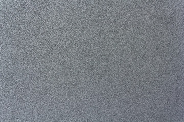 Grey rough plaster, concrete on wall closeup in sunny day, background, texture series