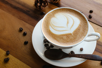 Close up of white coffee cup with latte art.