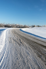 Fototapeta na wymiar White and snowy field in winter.