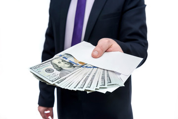 Businessman holding dollar banknotes and envelope in hands
