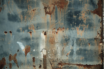 Texture of rusty metal with peeling paint