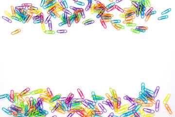 Fototapeta na wymiar Colorful paper clips isolated on white background with copy space. Back to school concept