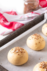 Food concept Proving, Proofing yeast dough of hamburger buns in bake pan before baking