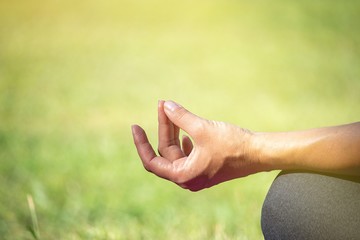 Woman is doing meditation focus at hand