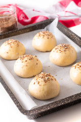 Food concept Proving, Proofing yeast dough of hamburger buns in bake pan before baking