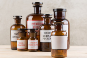 Retro pharmacy - vintage pharmacy bottles on wooden board
