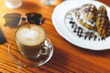 Coffee cup Served on wooden table.