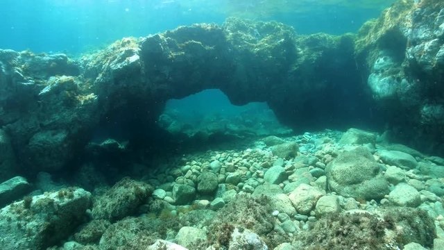 Natural arch in rock underwater in the Mediterranean sea, Spain, Costa Brava, Catalonia, Calella de Palafrugell