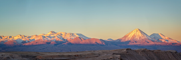 Andes mountain range at sunset, view from Moon Valley in Atacama desert, Chile - obrazy, fototapety, plakaty
