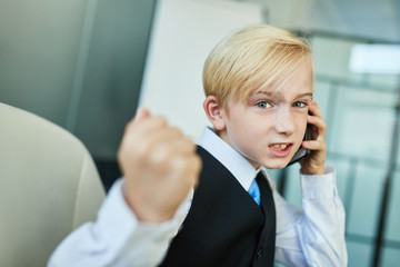 Child as a manager calling by smartphone