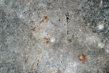 Rough stone wall with cracks of grey