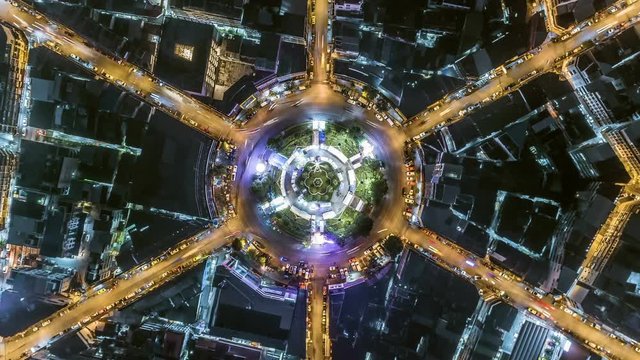 aerial top view traffic circle road roundabout multi 6 lanes in bangkok city at night, Time lapse top road in thailand,.