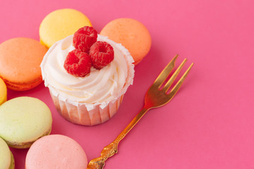 Yummy sweet cupcakes on light pink background