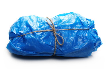 Fototapeta premium Crumpled blue nylon bag for recycling, isolated on white background