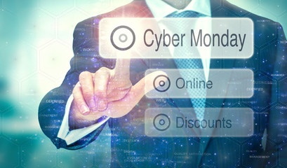 A businessman selecting a button on a futuristic display with a Cyber Monday concept written on it.