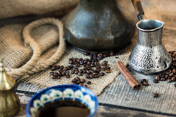 Everything for making real coffee. Cup,Turkish coffee pot, coffee beans