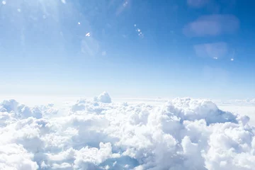 Foto op Plexiglas Clouds and sky from airplane window view © fotofabrika