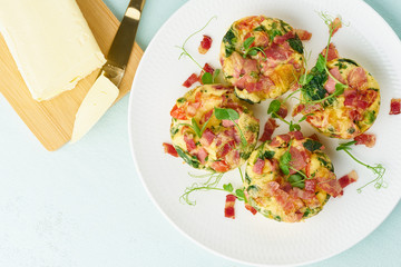 Egg muffin baked with bacon, ketogenic keto diet, pastel modern top view