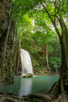 Clean green emerald water from the waterfall Surrounded by small trees - large trees, green colour, Erawan waterfall, Kanchanaburi province, Thailand © Ake