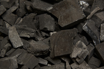 Many pieces of charcoal in the box