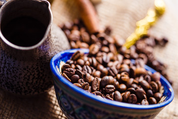 Fresh coffee in cezve on wooden table