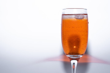 glass of sweet cocktail aperol Spritz with ice on white background