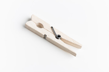 Wooden clothespins isolated on white background