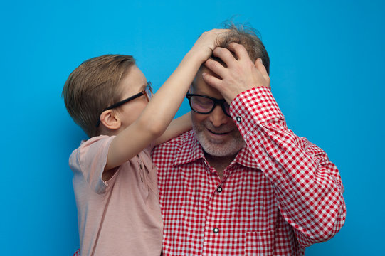 Little caring grandson pities beloved grandfather