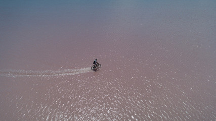 Bike driving in salt lake, adventure and delightful landscape texture