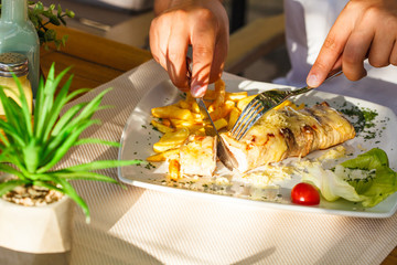 Traditional Montenegrin Meat Negush Steak on white plate in a restaurant.
