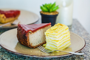 Vegan desserts: berry cake, napoleon cake and cheesecake in restaurant.