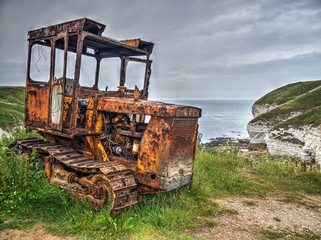 Fototapeta premium Derelict bulldozer, North Landing, Flamborough Head, East Yorkshire