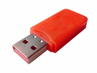 Red plastic USB flash drive isolated on white