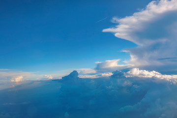 flight through white clouds and blue sky 