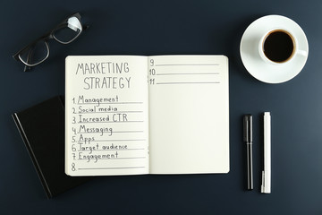 Digital marketing strategies concept. Hand written marketing plan. Close up, copy space, top view, flat lay, background.