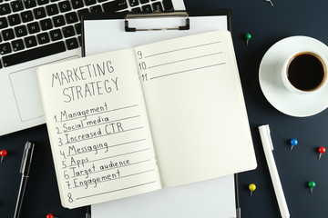 Fototapeta na wymiar Digital marketing strategies concept. Hand written marketing plan. Close up, copy space, top view, flat lay, background.
