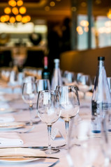 Empty Wine Glasses on a long table for gala dinner