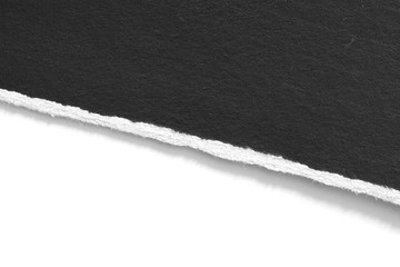 old torn black paper isolated on white background