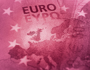 Brexit concept in red color composition against Euro banknote detail.