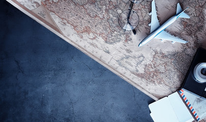 Travel concept. Map on the table andl aircraft.